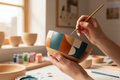 Hand painting a wooden bowl with geometric design