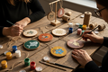Hand painted wood slice hanging decorations with coloured backgrounds featuring folk art fish, birds, holly, reindeer, snowflakes and botanicals